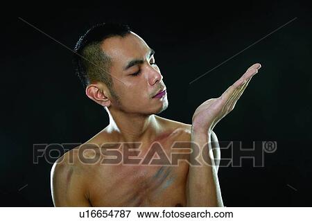 Stock Photo - Head And Shoulders, Asian Ethnicity, Focus, Signals, One Young Man Only, Bare Chest. Fotosearch
