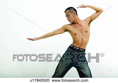 Stock Image - Martial Arts, One Person, Black Hair, Three-Quarter Length, Practice, Signals. Fotosearch