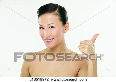 Stock Image - One Person, Human Thumb, Toothy Smile, One Young Woman Only, White Background, Success. Fotosearch