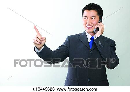 One Young Man Only, Talking, Communication, Shirt And Tie, Signals, Close-Up, Pointing View Large Photo Image Stock Image - One Young Man Only, Talking, Communication, Shirt And Tie, Signals, Close-Up, Pointing. Fotosearch