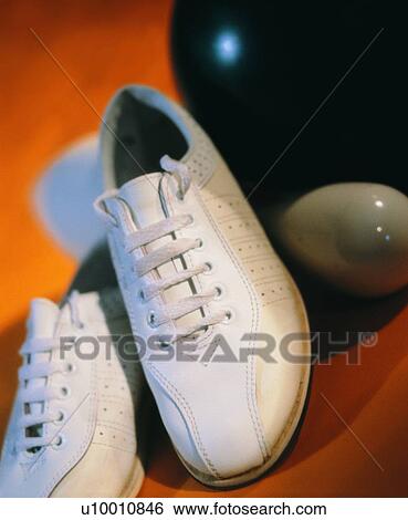 Stock Photograph - bowling shoes, sporting good, bowling ball, close up. Fotosearch