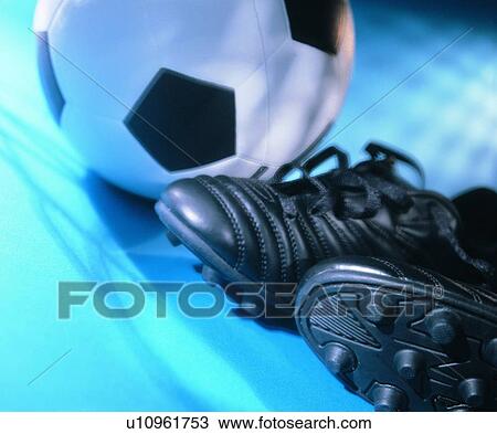 Stock Image - sporting good, soccer ball, close up, soccer shoes. Fotosearch