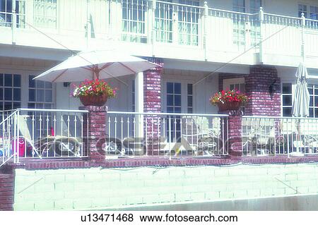 balcony, foreign, plant, building, umbrella, flower View Large Photo Image Stock Photo - balcony, foreign, plant, building, umbrella, flower. Fotosearch