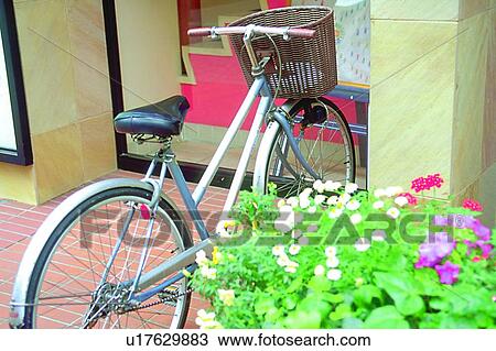Stock Image - scenery, foreign, sidewalk, store, bike, plant. Fotosearch