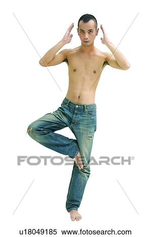 Balance, Standing On One Leg, Indoor, Portrait, Confidence View Large Photo Image Stock Photography - Balance, Standing On One Leg, Indoor, Portrait, Confidence. Fotosearch
