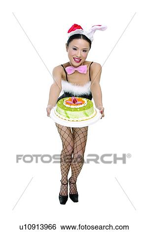 Chinese Ethnicity, Bending, Cake, Bow, Black Hair, Asian Ethnicity View Large Photo Image Stock Photograph - Chinese Ethnicity, Bending, Cake, Bow, Black Hair, Asian Ethnicity. Fotosearch