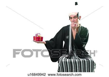 Stock Image - Chinese Ethnicity, Gift, Asian Ethnicity. Fotosearch