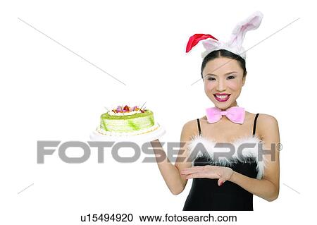 Stock Image - Close-Up, Black Hair, Chinese Ethnicity, Cake, Bow, Asian Ethnicity. Fotosearch