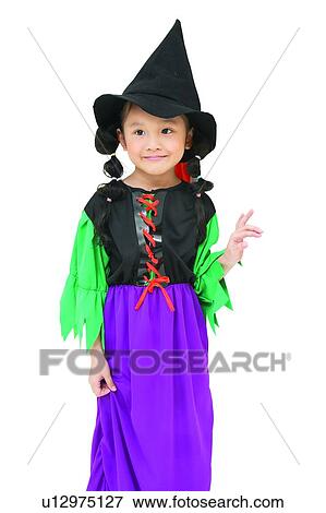Stock Photo - Standing, Fun, Innocence, Witch's Hat, Pigtails, Halloween, Indoor. Fotosearch