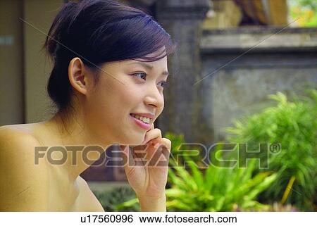 Stock Photograph - Beautiful, Close-Up, Cheerful, Brown Hair, Asian Ethnicity. Fotosearch