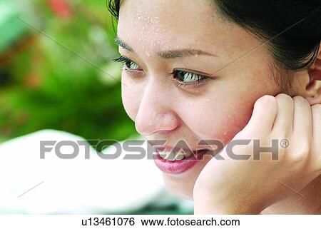 Focus On Foreground, Head In Hands, Black Hair, Close-Up, Joy, One Young Woman Only, Beauty View Large Photo Image Stock Photograph - Focus On Foreground, Head In Hands, Black Hair, Close-Up, Joy, One Young Woman Only, Beauty. Fotosearch