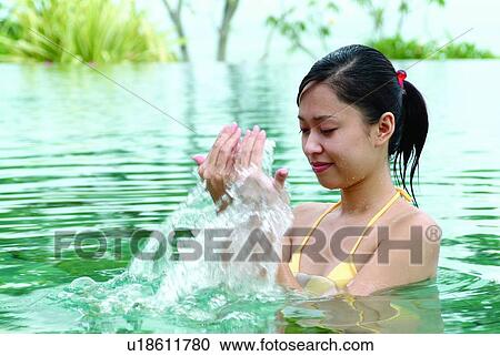 Stock Image - Young Adult, Asian, Purity, Refreshment, Eastern, Close-Up, Hygiene. Fotosearch
