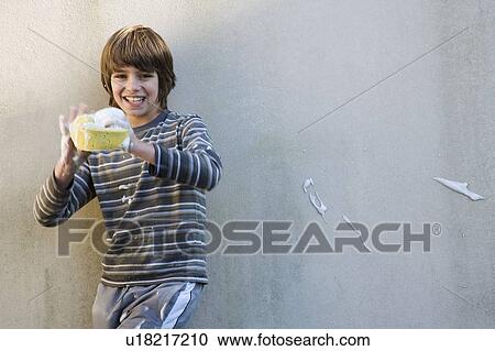 Boy playing with car sponge View Large Photo Image Stock Image - Boy playing with car sponge. Fotosearch