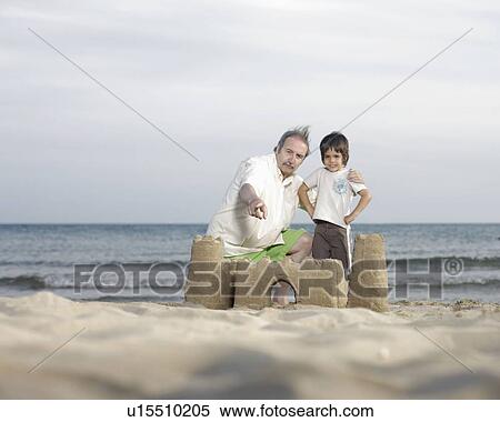 Grandfather and grandson on the beach View Large Photo Image Stock Photography - Grandfather and grandson on the beach. Fotosearch