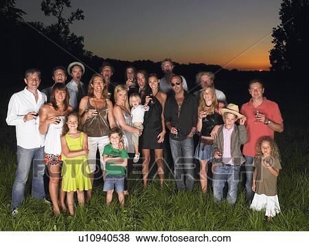 Group of people standing in a field View Large Photo Image Stock Photo - Group of people standing in a field. Fotosearch