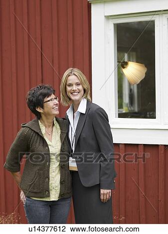 Mother and daughter outside country cottage View Large Photo Image Stock Image - Mother and daughter outside country cottage. Fotosearch