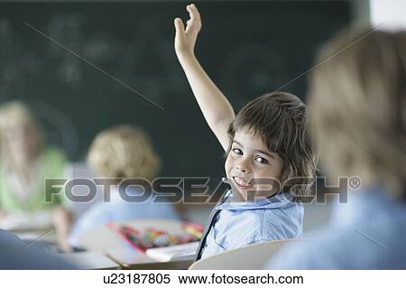 School boy raising hand in class View Large Photo Image Stock Photography - School boy raising hand in class. Fotosearch