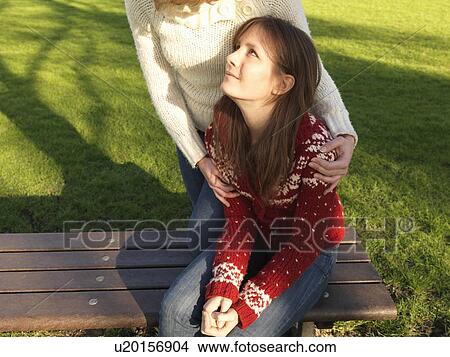 Picture - Woman holding woman. Fotosearch
