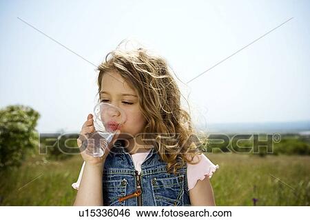 Stock Photograph - Girl drinking water. Fotosearch