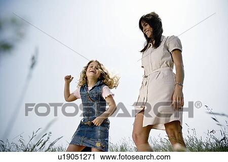 Mother and daughter dancing View Large Photo Image Stock Image - Mother and daughter dancing. Fotosearch