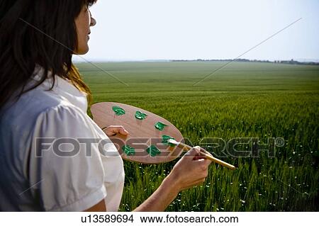 Woman holding painters palette View Large Photo Image Picture - Woman holding painters palette . Fotosearch
