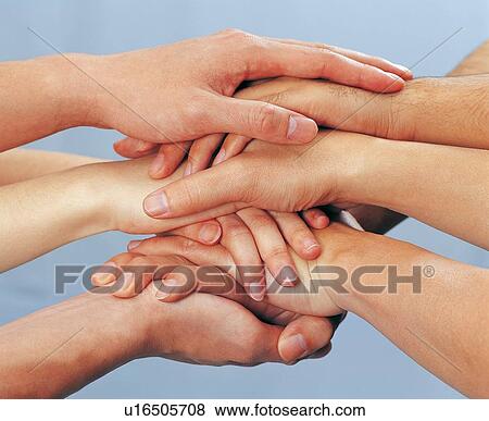 Stock Photo - Close-Up, Colored Background, Gesturing, Gripping, Group Of People. Fotosearch