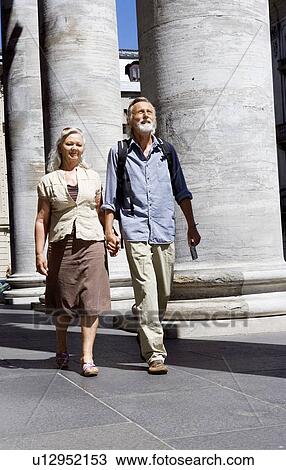 Couple walking together View Large Photo Image Stock Image - Couple walking together. Fotosearch