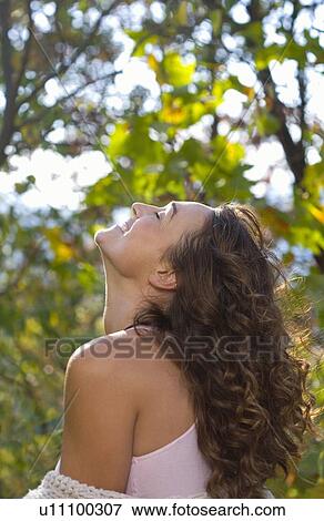 Stock Photo - Portrait of woman smiling.. Fotosearch