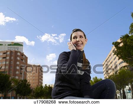 Teenage female on mobile phone View Large Photo Image Stock Photo - Teenage female on mobile phone. Fotosearch