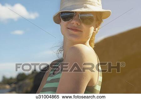 Young woman wearing sun hat. View Large Photo Image Stock Photography - Young woman wearing sun hat.. Fotosearch