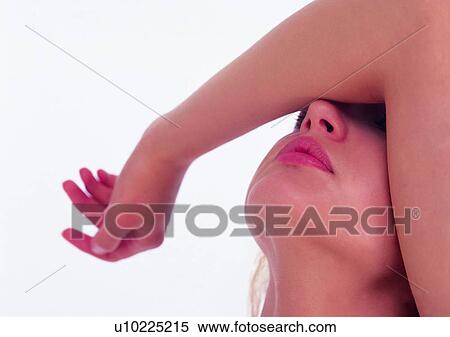 Stock Photography - Image Dictionary, Human Face, White Background, Close-Up, Arm Raised, The Female Physique. Fotosearch