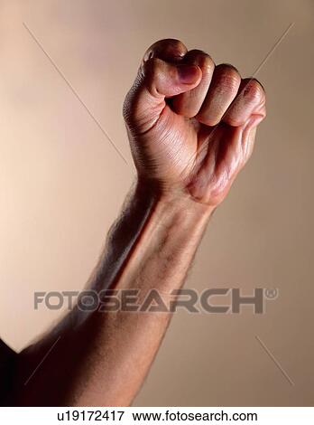 Stock Photo - Colored Background, Fist. Fotosearch