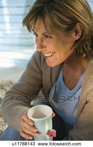 Woman Relaxing At Home View Large Photo Image Stock Image - Woman Relaxing At Home. Fotosearch