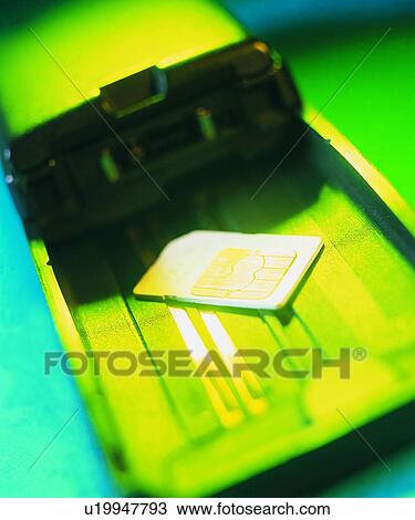 Stock Image - cell phone, inside, structure, sim card, machine, light. Fotosearch