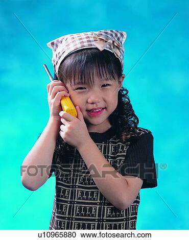 Stock Image - child, girl, scarf, intercom, smile, brand. Fotosearch