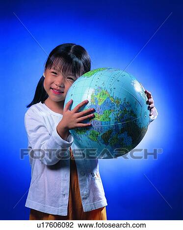 Stock Image - children, girl, light, globe, background, smile. Fotosearch