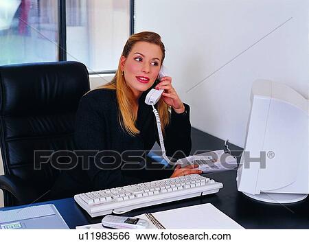 Stock Photograph - Computer Keyboard, Computer Equipment, One Young Woman Only, Office. Fotosearch