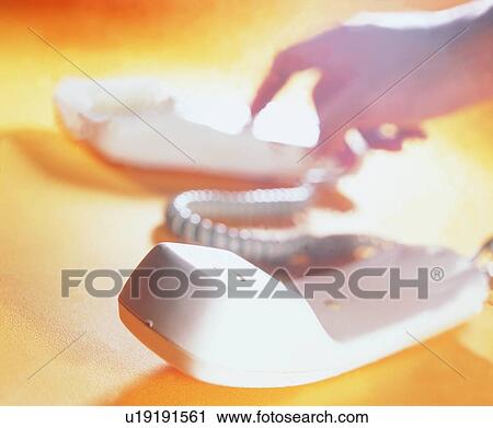 Stock Image - hand, shadow, dail, light, microphone, telephone. Fotosearch