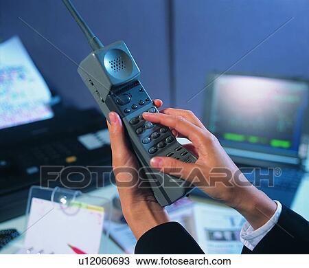 Stock Image - table, dail, hand, paper, transceiver, office. Fotosearch
