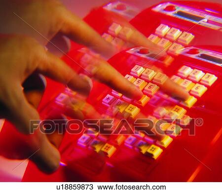 Stock Image - telephone, hand, dail, keystroke, payphone, red. Fotosearch