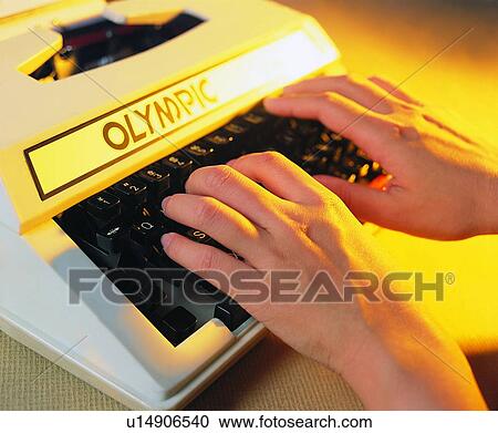 Stock Image - typewriter, brand, hands, typing, keyboard, light. Fotosearch