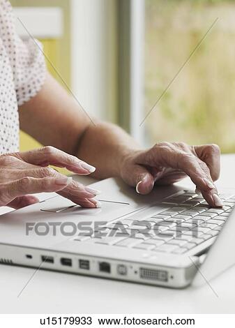 Close up of senior hands on keyboard View Large Photo Image Stock Image - Close up of senior hands on keyboard. Fotosearch