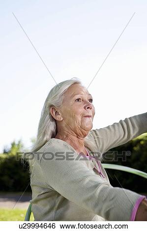 Mature woman with hula-hoop View Large Photo Image Stock Photograph - Mature woman with hula-hoop. Fotosearch