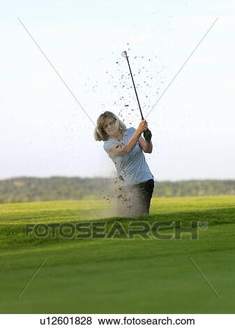 Woman in golf bunker View Large Photo Image Stock Photo - Woman in golf bunker. Fotosearch