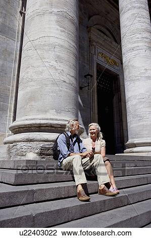 Couple resting on stairs View Large Photo Image Stock Image - Couple resting on stairs. Fotosearch