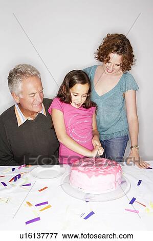 Girl cutting birthday cake View Large Photo Image Stock Photo - Girl cutting birthday cake. Fotosearch