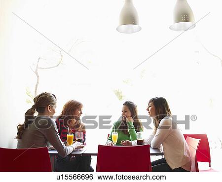 Group of teenage females in cafe View Large Photo Image Stock Photograph - Group of teenage females in cafe. Fotosearch