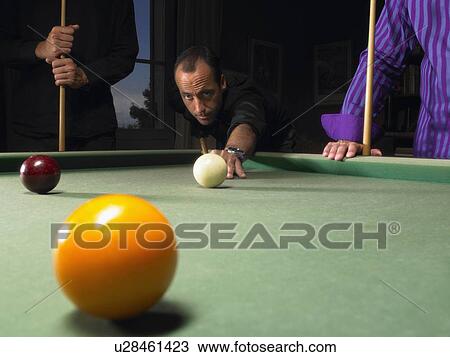 Stock Image - Men playing snooker. Fotosearch