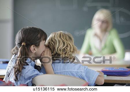 School girl whispering View Large Photo Image Stock Photography - School girl whispering. Fotosearch