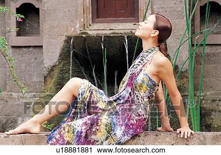 Stock Image - indulgence, care, sarong, sitting, therapeutic. Fotosearch